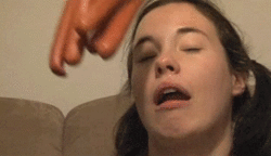 girl-getting-hit-in-the-face-with-hotdogs-gif.gif
